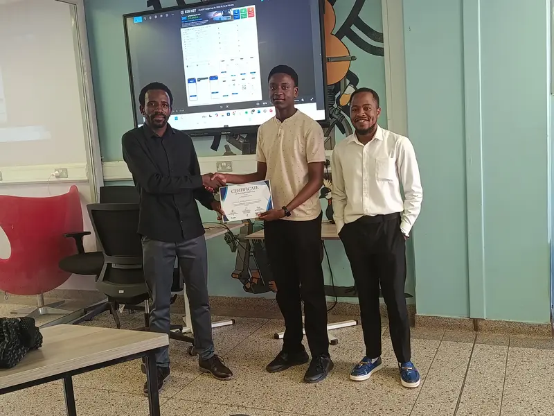 A participant receiving their certificate