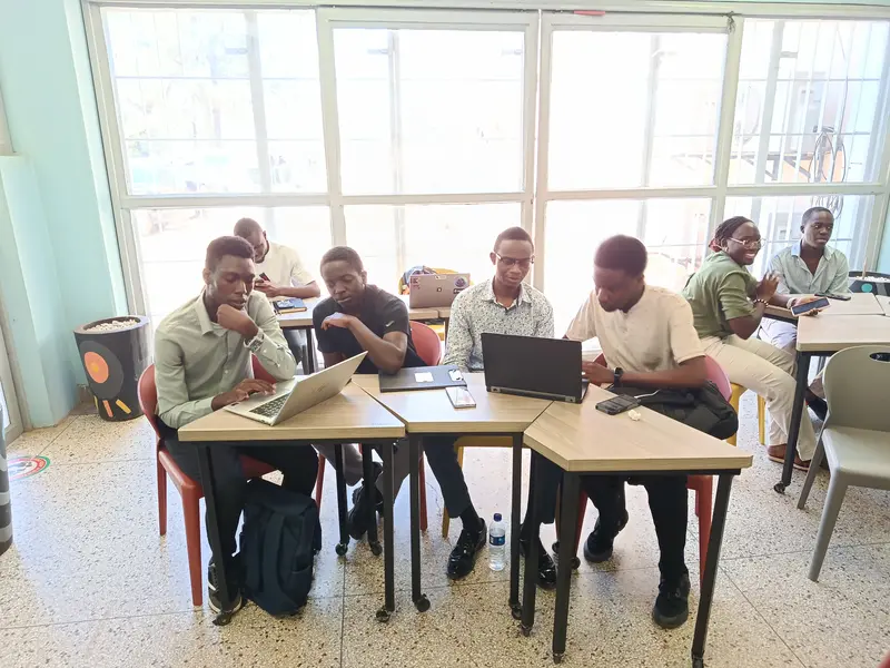 Participants working together on laptops